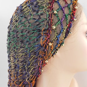 May include: A rainbow colored hair net with gold beads. The net is made of a stretchy material and is designed to hold hair in place.