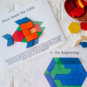 May include: A colorful wooden block puzzle depicting a fish, with the text "Jesus feeds the 5,000" above it. The puzzle is made of various geometric shapes in red, orange, blue, and green. Additional blocks and text are also visible.