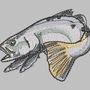 May include: Embroidered image of a fish in shades of gray, white, and yellow, with black outlining. The fish is angled, with its mouth open and fins extended. The background is a solid light gray.