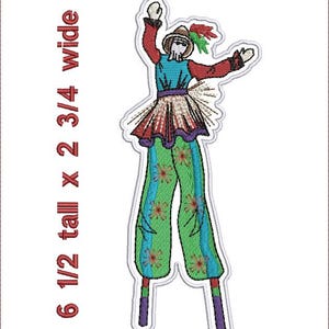 May include: Embroidered patch of a whimsical figure on stilts. The figure is wearing a red, blue, and green outfit with a straw hat and a feather. The patch is 6 1/2 inches tall and 2 3/4 inches wide.