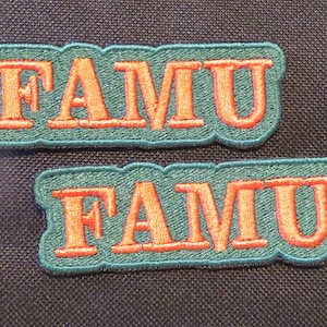 May include: Two green and orange embroidered patches with the word "FAMU" in orange letters.