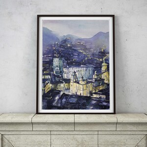 May include: A watercolor painting of a city skyline at dusk. The buildings are painted in shades of blue and yellow, with a few lights visible. The sky is a soft purple, and the mountains in the background are a hazy blue.