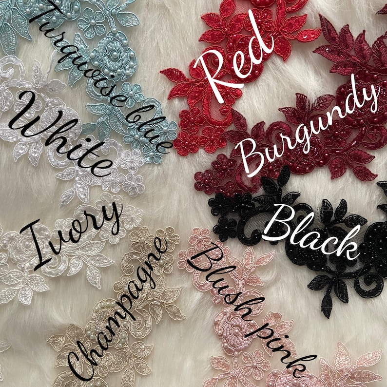 May include: Assortment of lace trim in various colors, including white, ivory, champagne, blush pink, turquoise blue, red, burgundy, and black. Each trim features a delicate floral design with pearl embellishments.