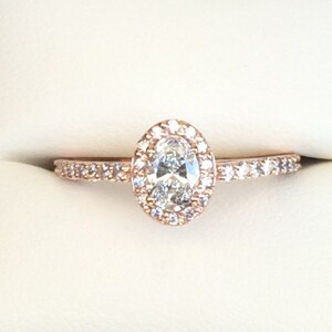 Oval Diamond Halo Engagement Ring in Rose Gold