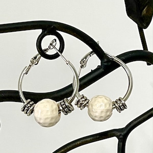 Golf hoop earrings. &quot; Matching necklace available in the sports section &quot;