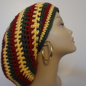 May include: A handmade crochet hat in a striped pattern of red, yellow, and green. The hat is a beanie style, with a close fit. The colors are vibrant and the stitches are clearly visible, showcasing the craftsmanship of the item.