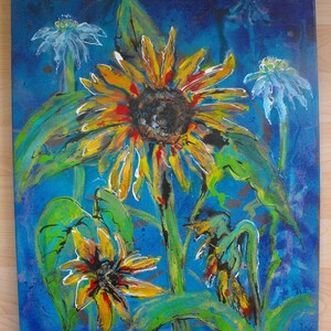May include: A painting of sunflowers and other flowers on a blue background. The sunflowers are yellow, orange, and red. The other flowers are white and blue. The painting is done in a loose, expressive style.