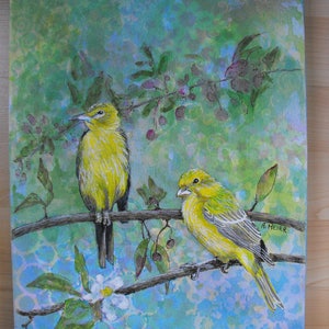 May include: A watercolor painting of two yellow birds perched on a branch with green leaves and purple flowers. The background is a light blue and green watercolor wash. The painting is signed "A. HEIER" in the bottom right corner.