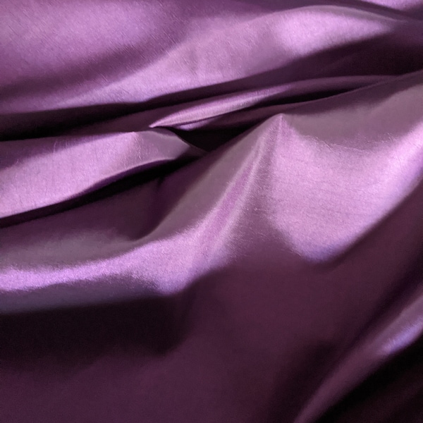 Plum taffeta 59"  wide.   Free swatches upon request, Threads and "rush" shipping available.