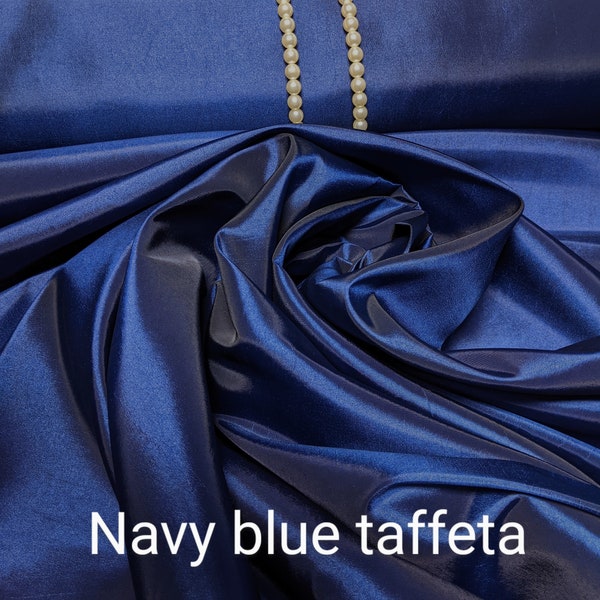 Navy blue taffeta by the yard 58-60" wide.  Free swatches upon request, Threads and "rush" shipping available.