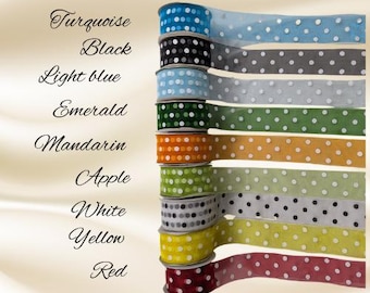May include: A collection of polka dot ribbon spools in various colors, including turquoise, black, light blue, emerald, mandarin, apple, white, yellow, and red. The image also includes the names of the colors.