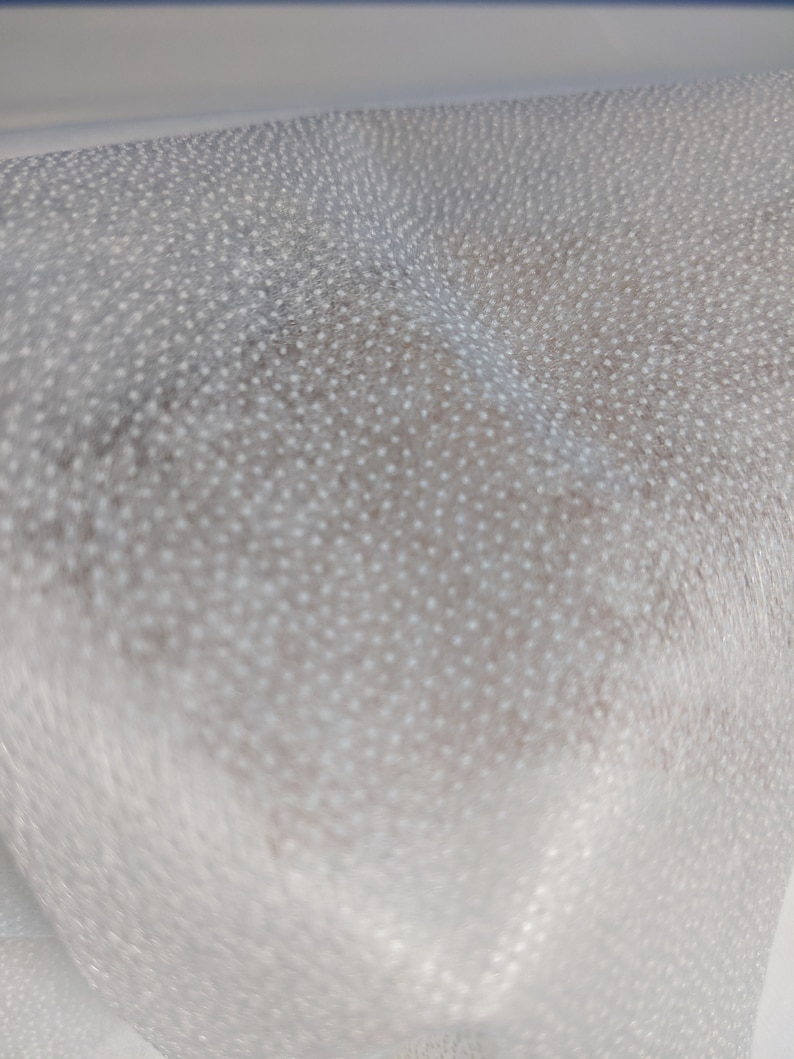 May include: White bubble wrap with a textured surface.