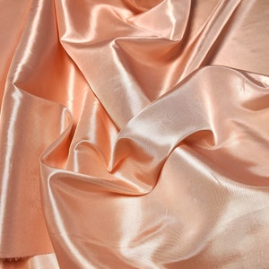 Peach taffeta 58-60&quot; wide sold by the yard.   Free swatches upon request,  &quot;rush&quot; shipping available.