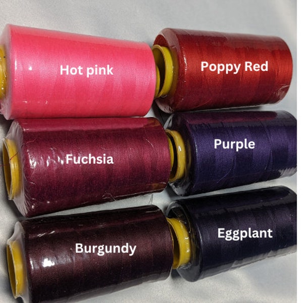 Sewing threads  different tones of Red and Purple new or almost full 6000 yards cone all purpose 100% spun polyester.