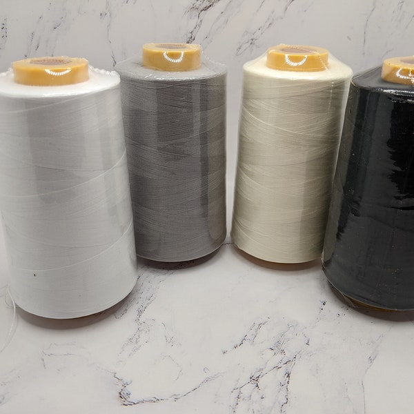 Sewing threads white, black, silver and ivory, 6000 yards cone all purpose 100% spun polyester overlock cone. Rush shipping available.