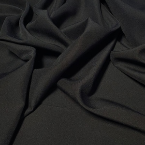 Black  Gabardine Tropical 60&quot; to 62&quot; wide by the yard.  100% Polyester. Free swatch and &quot;rush&quot; shipping available.