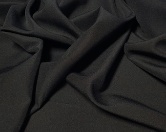 Black  Gabardine Tropical 60&quot; to 62&quot; wide by the yard.  100% Polyester. Free swatch and &quot;rush&quot; shipping available.