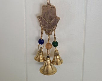 Shiny hand of Fatima wind chime in brass with beads and bells