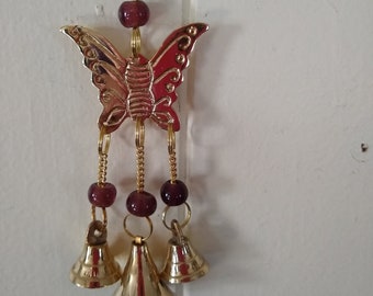 Shiny butterfly wind chime in brass with beads and bells