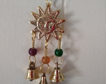 Shiny sun  wind chime in brass with beads and bells