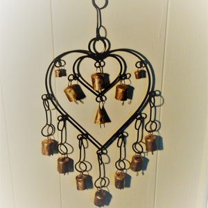 Iron heart in heart with bells wind chimes