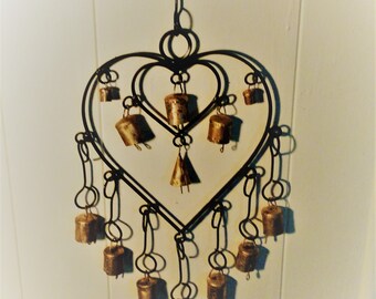 Iron heart in heart with bells wind chimes