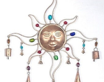 beautiful sun with bells and beads wind chimes