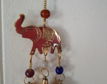 Shiny elephant wind chime in brass with beads and bells