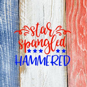 May include: Red, white, and blue wooden sign with the text "star spangled hammered" in red and blue lettering.