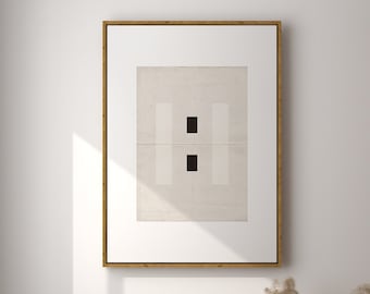 May include: A light wood framed picture with a white background and two black squares. A wicker chair with a chrome frame sits in front of the picture. A vase with dried pampas grass sits on the floor in front of the picture.