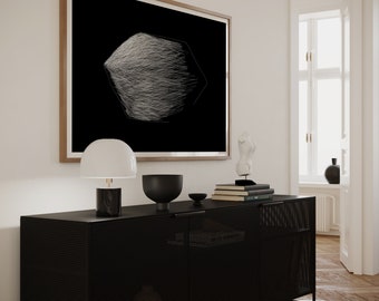 May include: A black metal cabinet with a wire mesh front and two doors. The cabinet is sitting on a wooden floor and has a lamp, a bowl, and books on top of it. A framed black and white abstract art print hangs on the wall behind the cabinet.