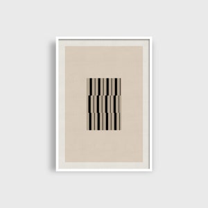 May include: A framed print with a beige background and a black and white geometric pattern in the centre.