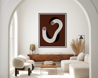 May include: A white and black abstract art print with a brown background hangs on a white wall in a living room. The print is framed in black. The room has a white couch, two white chairs, a wooden coffee table, and a wooden shelf.