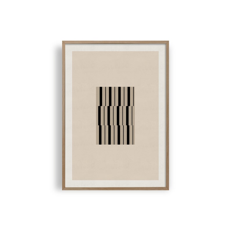 May include: A framed print featuring a black and white geometric pattern on a beige background.