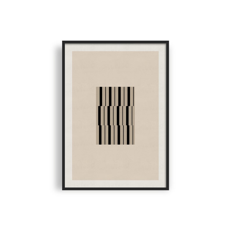 May include: A framed print featuring a black and white geometric pattern on a beige background.