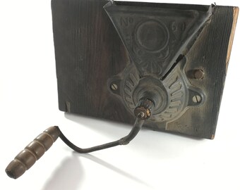 Wall mounted coffee grinder with wood handle