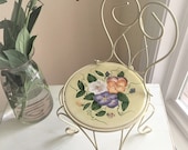 Farmhouse Chic White Metal Chair Plant Stand with Yellow and Floral Ceramic Trivet Insert