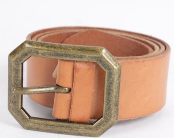May include: A tan leather belt with a large, octagonal, brass buckle.