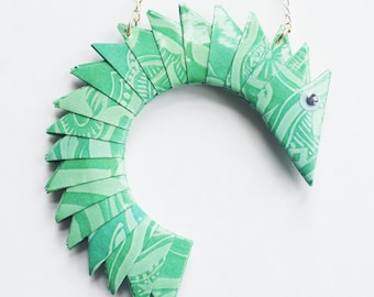 SALE- Unique reversible necklace. Curved glossy varnished paper fish/snake/creature with silver plated chain and googly eyes