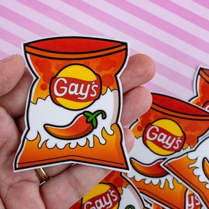 May include: A set of five red and white chip bag stickers with a chili pepper and the text "Gay's" on each.