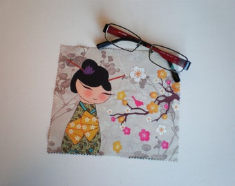 May include: A microfiber cleaning cloth with a colorful design featuring a cartoon geisha with a cherry blossom branch and a small bird.