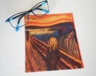 May include: A microfiber cleaning cloth with a colorful image of Edvard Munch's "The Scream" painting. The painting features a figure with a distorted face, a swirling sky, and a bridge.