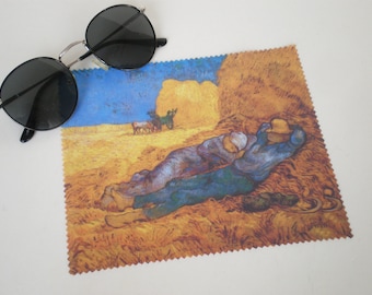 May include: A microfiber cleaning cloth with a printed image of a painting by Vincent van Gogh. The painting depicts a man sleeping in a field of wheat with a blue sky in the background.