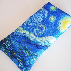 May include: A blue and yellow fabric pouch with a print of Vincent van Gogh's "Starry Night" painting.