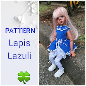 May include: A doll wearing a handmade blue crochet dress with white lace trim and a pearl beaded belt. The doll has pink hair and white shoes. The image includes the text "PATTERN Lapis Lazuli" and a green four-leaf clover.