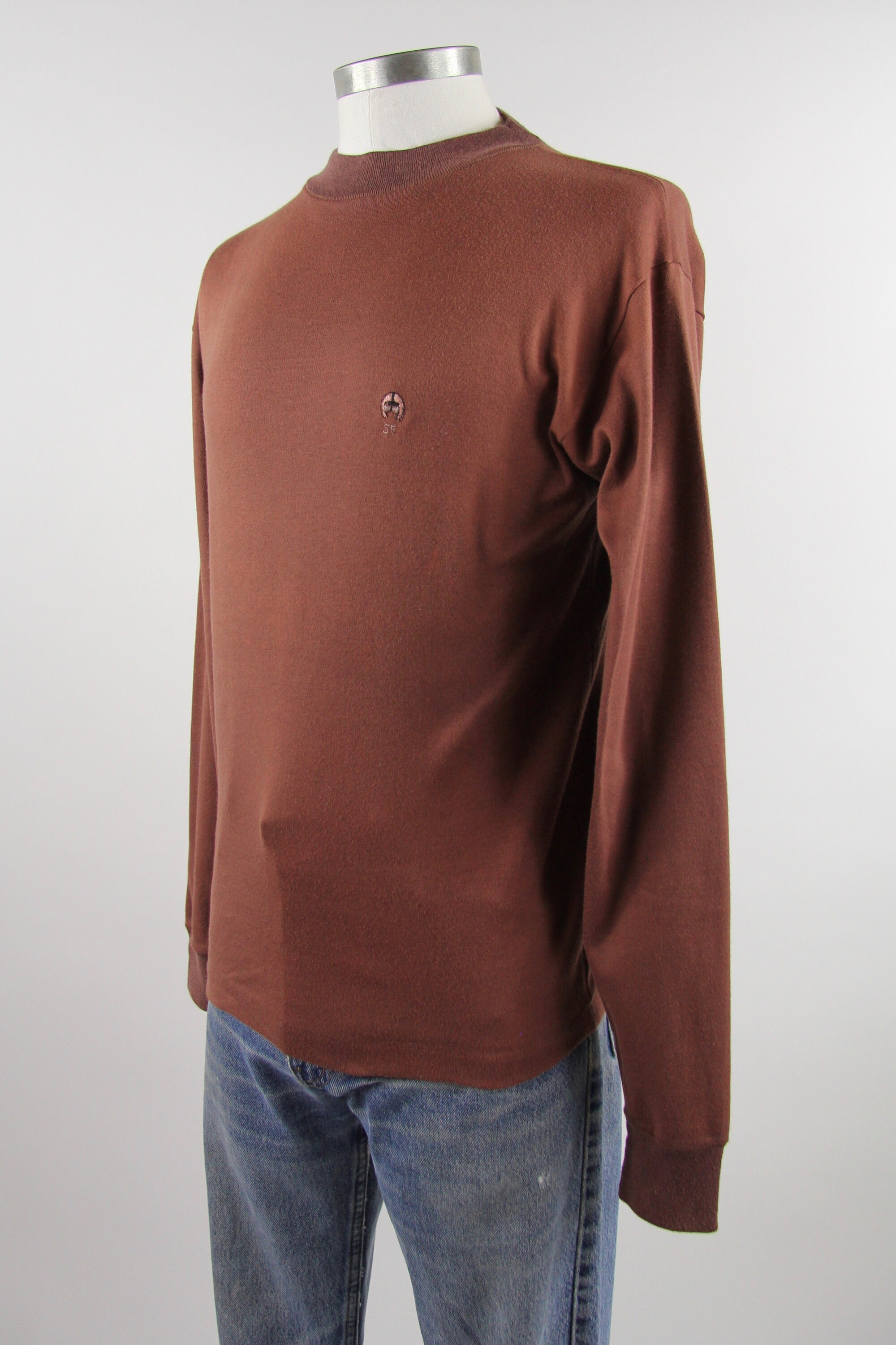 turtle neck with shirt over it