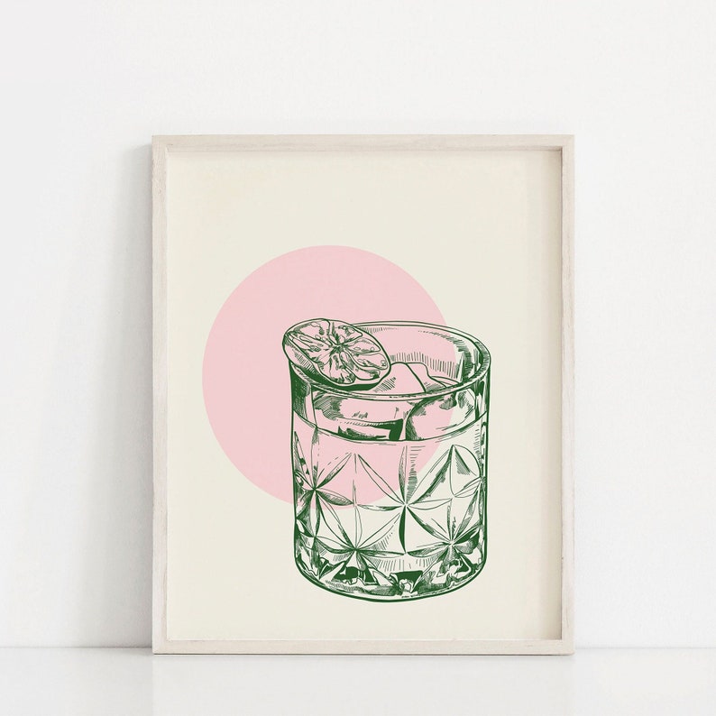 May include: A green line drawing of a cocktail glass with ice and a lime wedge, set against a pink circle on a cream background.