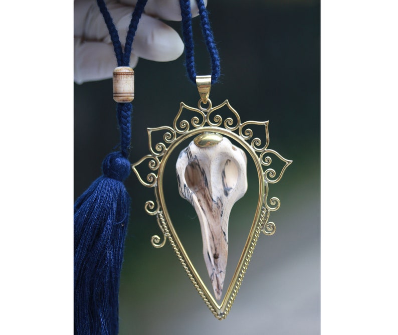 Bids skull and brass pendant hand made tamarind wood exclusive designs by tribal island price per piece. set in brass SALES