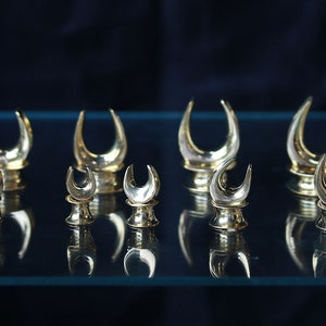 Brass ear saddle size , ear gauges, price per pair .