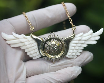 wings and flower of life  pendant, hand made buffalo bone brass and hand made brass chains , price per piece